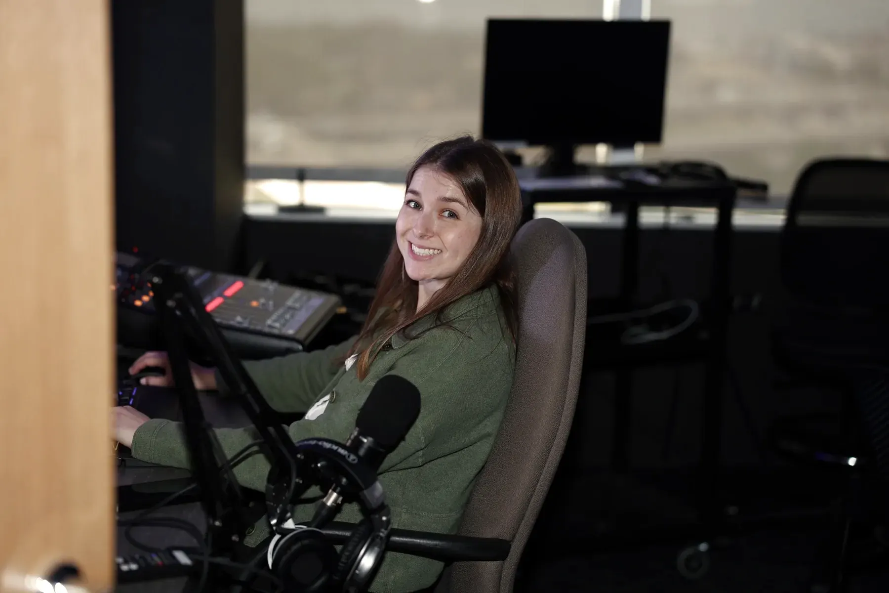 RNCN producer working at the studio production console